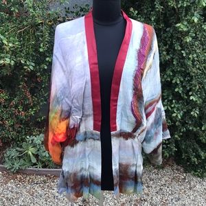 Abstract patterned open front cardigan.